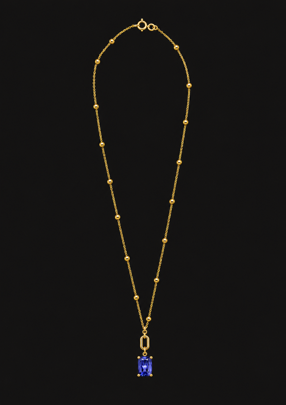 Logo Knot Beaded Tanzanite Necklace in 18K Gold — black background product cover